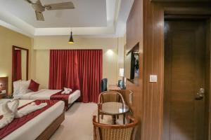Postel nebo postele na pokoji v ubytování Park Avenue Hotel & Apartments Trichy
