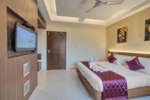 Postel nebo postele na pokoji v ubytování Park Avenue Hotel & Apartments Trichy