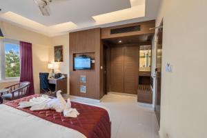 Postel nebo postele na pokoji v ubytování Park Avenue Hotel & Apartments Trichy