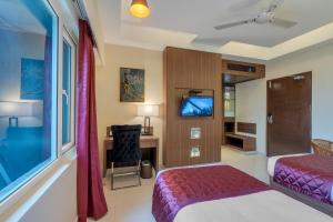 Postel nebo postele na pokoji v ubytování Park Avenue Hotel & Apartments Trichy