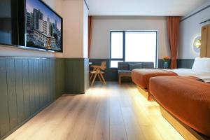TV a/nebo společenská místnost v ubytování Shenzhen Xili Ruixi Hotel