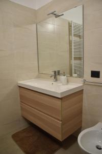 a bathroom with a sink and a mirror at Mareluna in Torremaggiore +7 photos