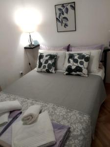 Postel nebo postele na pokoji v ubytování Alex Apartment