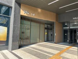 an entrance to a building with a sign on it at Byeollae Station I-park Suite Apartment 16F in Namyangju