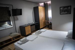Postel nebo postele na pokoji v ubytování Center Boutique Hotel