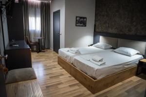 Postel nebo postele na pokoji v ubytování Center Boutique Hotel