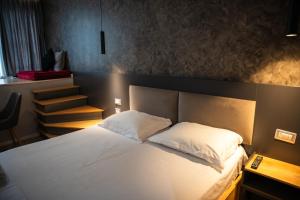 Postel nebo postele na pokoji v ubytování Center Boutique Hotel