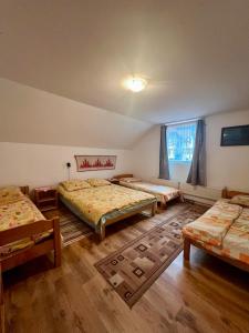 Postel nebo postele na pokoji v ubytování Báncs Vidéki Vendégház és Tanya