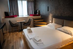 Postel nebo postele na pokoji v ubytování Center Boutique Hotel