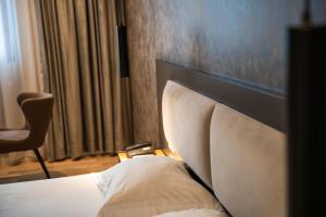 Postel nebo postele na pokoji v ubytování Center Boutique Hotel