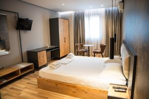 Postel nebo postele na pokoji v ubytování Center Boutique Hotel + 37 fotografií