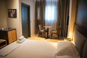 Postel nebo postele na pokoji v ubytování Center Boutique Hotel
