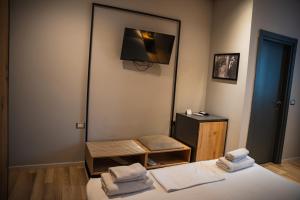 Postel nebo postele na pokoji v ubytování Center Boutique Hotel