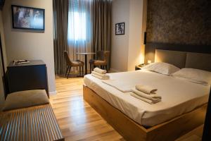 Postel nebo postele na pokoji v ubytování Center Boutique Hotel