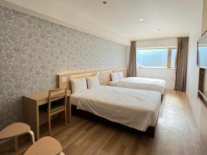 Postel nebo postele na pokoji v ubytování Kansai International Airport Hotel 11 + 30 fotografií