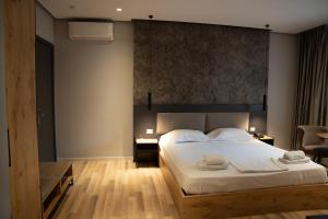 Postel nebo postele na pokoji v ubytování Center Boutique Hotel