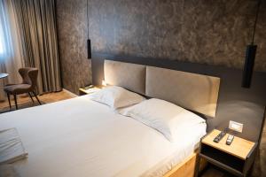 Postel nebo postele na pokoji v ubytování Center Boutique Hotel