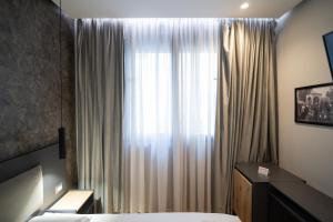 Postel nebo postele na pokoji v ubytování Center Boutique Hotel