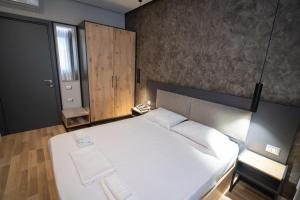 Postel nebo postele na pokoji v ubytování Center Boutique Hotel