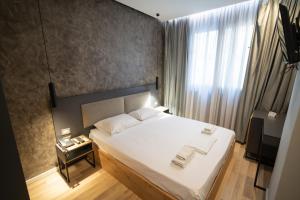 Postel nebo postele na pokoji v ubytování Center Boutique Hotel