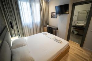 Postel nebo postele na pokoji v ubytování Center Boutique Hotel