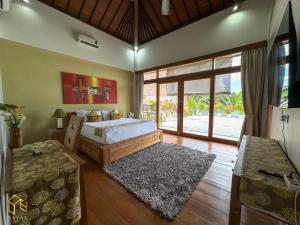 Ένα ή περισσότερα κρεβάτια σε δωμάτιο στο Tranquil Classic Balinese Villa +21 φωτογραφίες