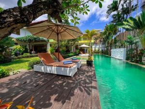 Πισίνα στο ή κοντά στο Tranquil Classic Balinese Villa