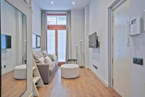 TV a/nebo společenská místnost v ubytování Uma Suites Barceloneta Beach