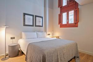 Postel nebo postele na pokoji v ubytování Uma Suites Barceloneta Beach