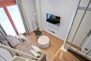 TV a/nebo společenská místnost v ubytování Uma Suites Barceloneta Beach