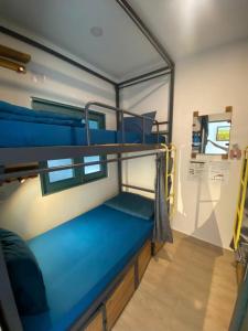 a room with two bunk beds in a room at THE JOYS HOSTEL in Ho Chi Minh City