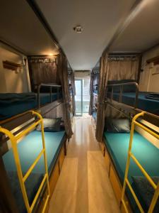 a room with two bunk beds on a train at THE JOYS HOSTEL in Ho Chi Minh City