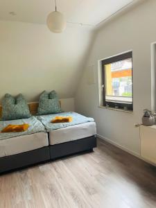 Rúm í herbergi á Ferienwohnung Gaßmann