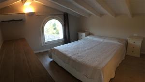 Postel nebo postele na pokoji v ubytování RESIDENCE ELEGANCE ville ed appartamenti a Porto Pino