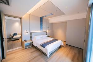 Voodi või voodid majutusasutuse Chaozhou Yuyu Hotel toas