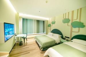 Voodi või voodid majutusasutuse Chaozhou Yuyu Hotel toas