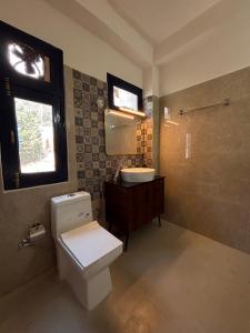 Koupelna v ubytování Whistling Pines Homestay