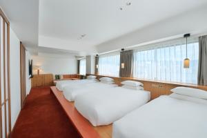 Postel nebo postele na pokoji v ubytování Hotel Grand Bach Kyoto Select