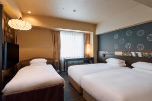 Postel nebo postele na pokoji v ubytování Hotel Grand Bach Kyoto Select