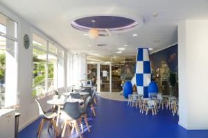 Reštaurácia alebo iné gastronomické zariadenie v ubytovaní htop Olympic #htopEnjoy