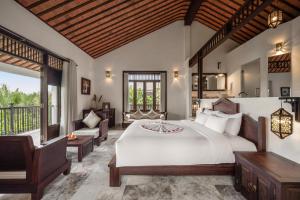 Voodi või voodid majutusasutuse Legacy Hoi An Resort toas
