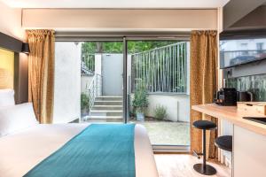Ένα ή περισσότερα κρεβάτια σε δωμάτιο στο Maison Menilmontant