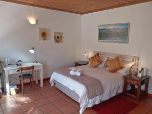 Кровать или кровати в номере Desert Rose Guesthouse