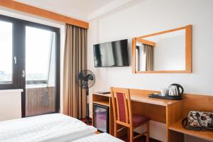 Postel nebo postele na pokoji v ubytování Hotel Globus