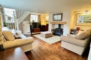 a living room with two couches and a fireplace at Winsor Croft in Southampton
