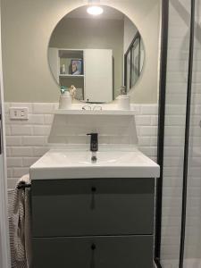 a bathroom with a sink and a mirror at Charme e Tranquillità in Montagna in Rocca di Mezzo +23 photos