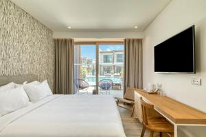 TV a/nebo společenská místnost v ubytování Utopia Blu Hotel