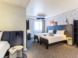 Postel nebo postele na pokoji v ubytování ibis Dunkerque