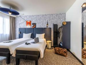 Postel nebo postele na pokoji v ubytování ibis Dunkerque + 34 fotografií