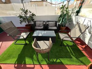 Posezení v ubytování Penthouse con terraza- 2D 2B- Triana